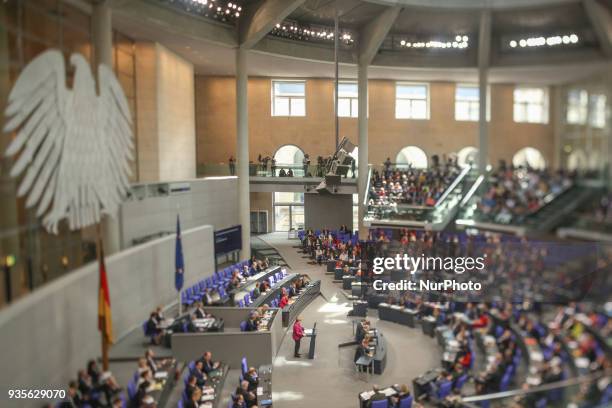 Image was created using a variable planed lens.) German Chancellor Angela Merkel delivers the first government declaration of her new government to...