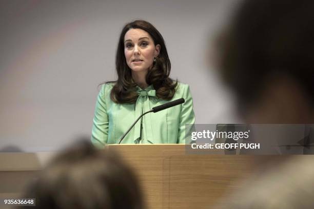 Britain's Catherine, Duchess of Cambridge addresses a symposium she convened with The Royal Foundation on early intervention for children and...