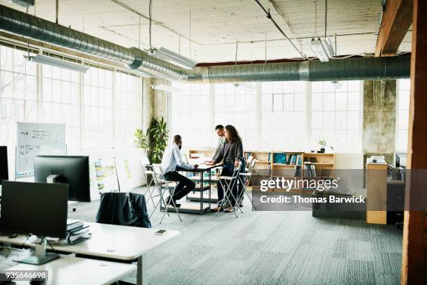 architects in project meeting at conference table in design studio - architect office ストックフォトと画像