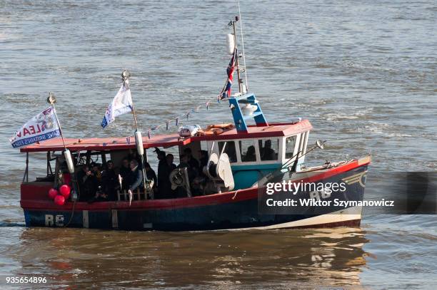 Protestor throws out fishes into the river Thames as 'Fishing for Leave' campaigners stage a protest against the impact of Brexit transition deal on...