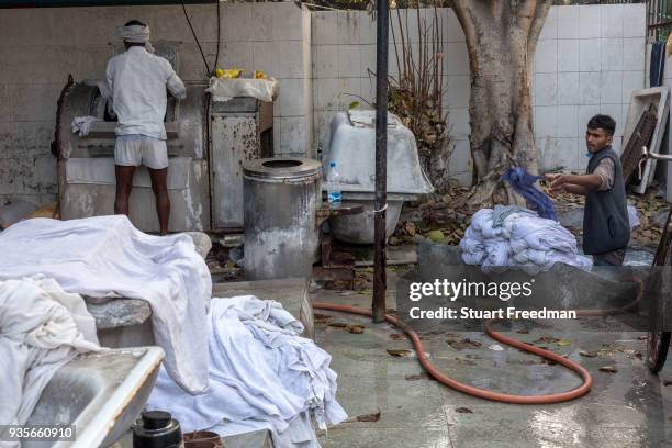 Dhobi wallahs or washermen, launder clothes and linen at the Devi Prasad Sadan Dhobi Ghat in New Delhi, India. The ghat is home to around 64...