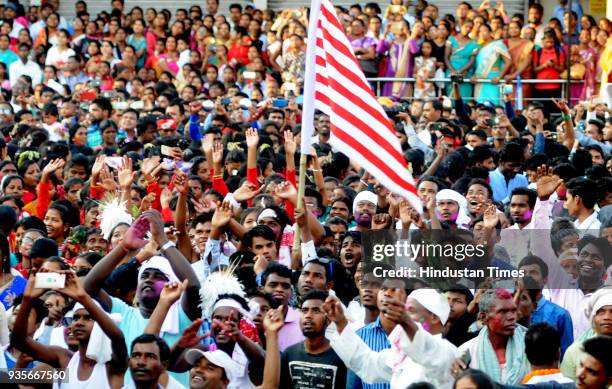 Tribal youths with their traditional dresses take part in Sarhul Festival procession on March 20, 2018 in Ranchi, India. The festival marks the...