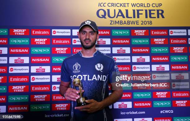 Safyyaan Sharif of Scotland with The Player of The Match award after The ICC Cricket World Cup Qualifier between The West Indies and Scotland at The...