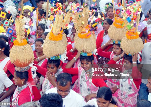 Tribal youths with their traditional dresses take part in Sarhul Festival procession on March 20, 2018 in Ranchi, India. The festival marks the...