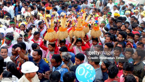 Tribal youths with their traditional dresses take part in Sarhul Festival procession on March 20, 2018 in Ranchi, India. The festival marks the...
