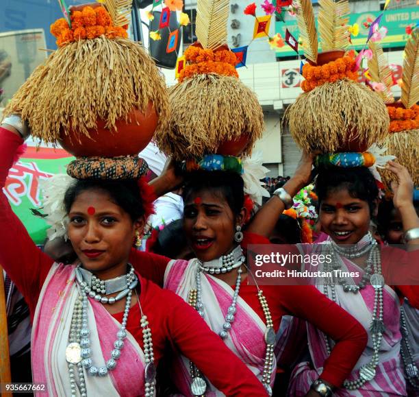 Tribal youths with their traditional dresses take part in Sarhul Festival procession on March 20, 2018 in Ranchi, India. The festival marks the...