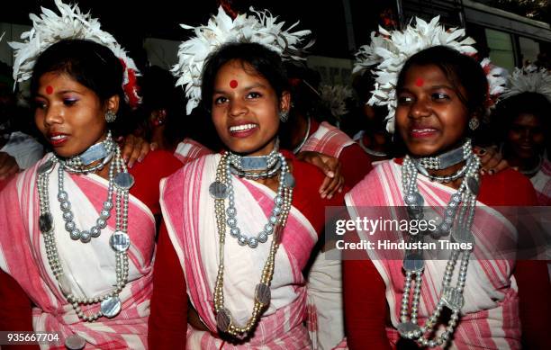 Tribal youths with their traditional dresses take part in Sarhul Festival procession on March 20, 2018 in Ranchi, India. The festival marks the...