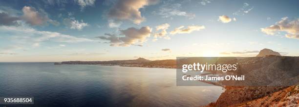 panoramic of spanish coastal city at sunset, xabia, spain - mediterranean sea sunset stock pictures, royalty-free photos & images