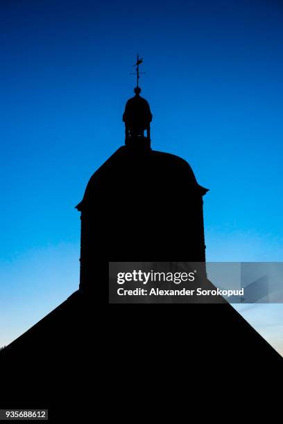 old church silhouette on blue sky background, vezelay, france - abby road stock-fotos und bilder