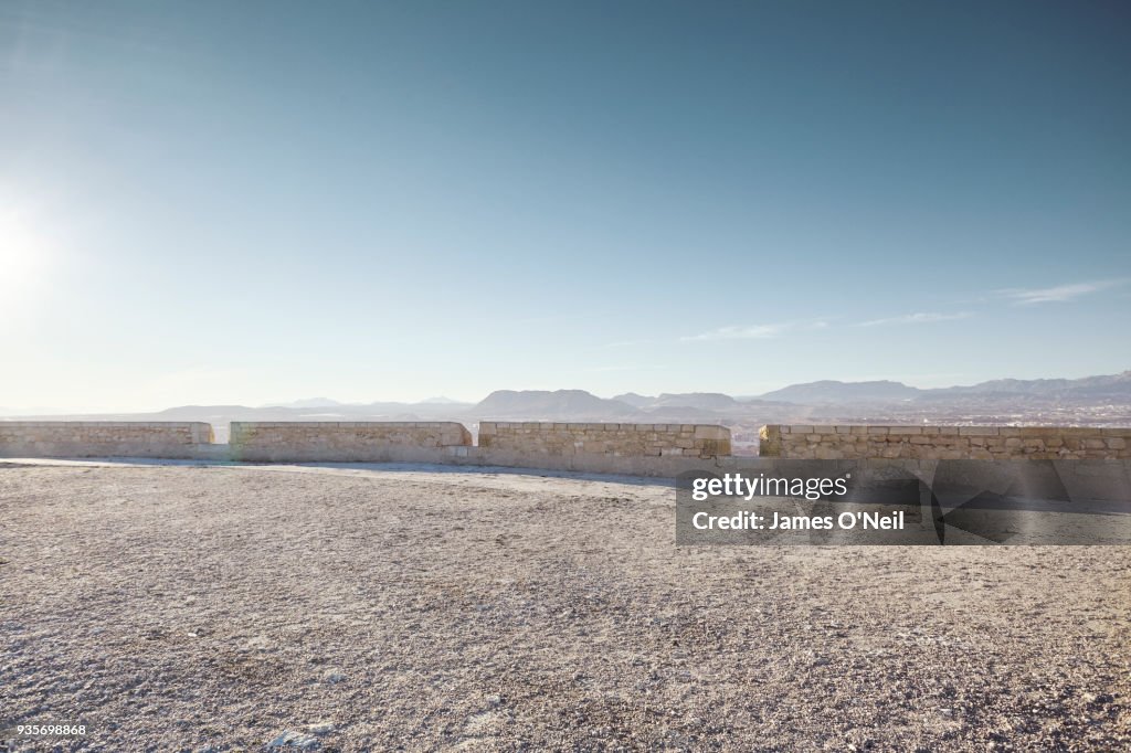 Empty gravel plateau with distant mountains for automotive placement