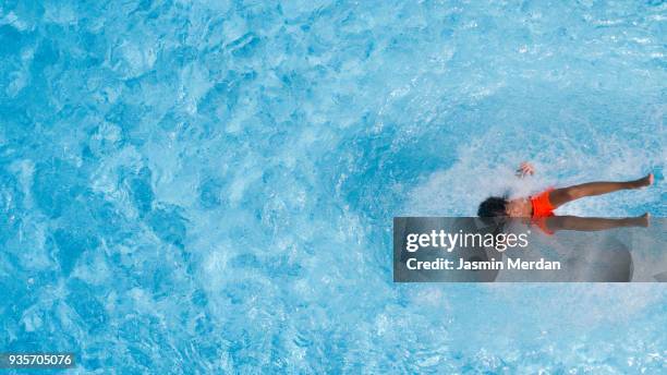 kid dives into the water - pond stock pictures, royalty-free photos & images