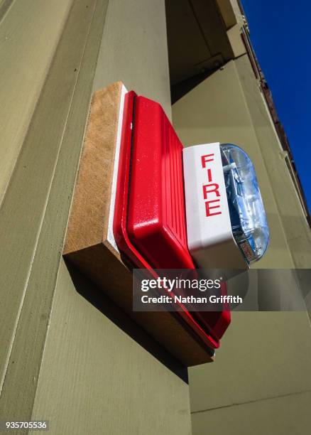 fire alarm on building wall - ellensburg stock pictures, royalty-free photos & images