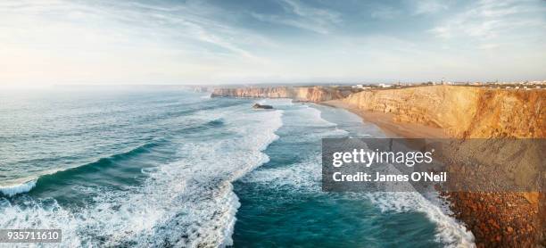 panoramic looking down at sagres beach and waves in the ocean, algarve, portugal - sagres ストックフォトと画像