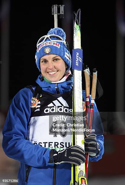 Michaela Ponza of Italy poses during the flower ceremony after she reaches the seventh place in Women's 15 km Individual event of the E.ON Ruhrgas...