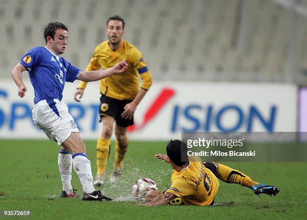 Leonardo of AEK Athens competes with Seamus Coleman of Everton during the Europa League Match between AEK Athens and Everton at Spyros Louis Stadium,...