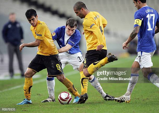 Leonardo and Geraldo of AEK Athens competes with Seamus Coleman of Everton during the Europa League Match between AEK Athens and Everton at Spyros...