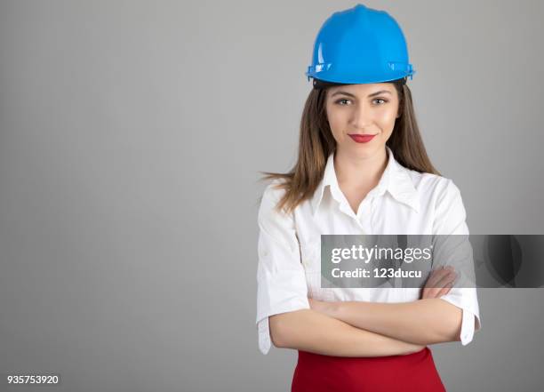 worker woman with blue helmet - skirt isolated stock pictures, royalty-free photos & images