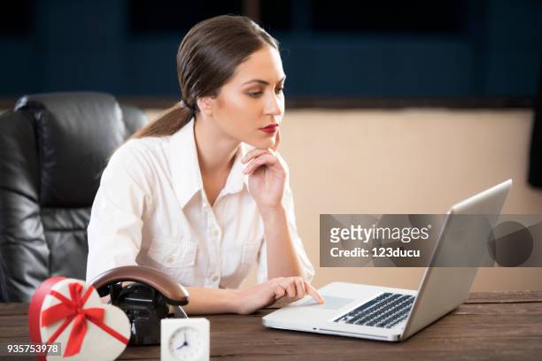 young woman working with laptop - 123ducu stock pictures, royalty-free photos & images