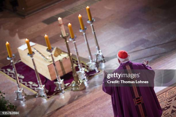 Cardinal Reinhard Marx speaks at the coffin of Cardinal Karl Lehmann in the Mainzer Dom cathedral during the funeral service for Lehmann on March 21,...