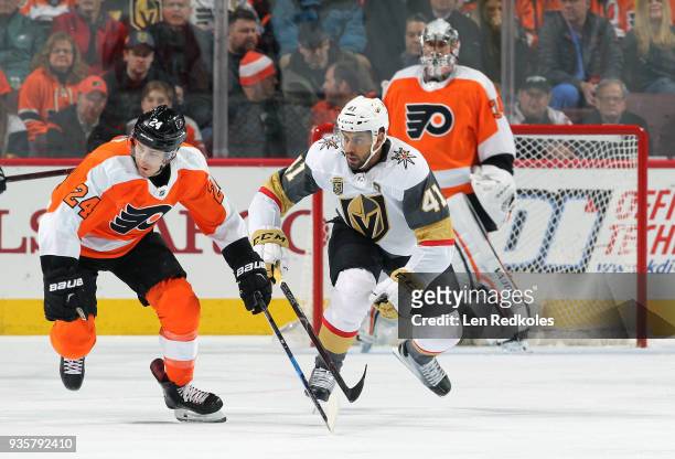 Matt Read of the Philadelphia Flyers skates against Pierre-Edouard Bellemare of the Vegas Golden Knights on March 12, 2018 at the Wells Fargo Center...