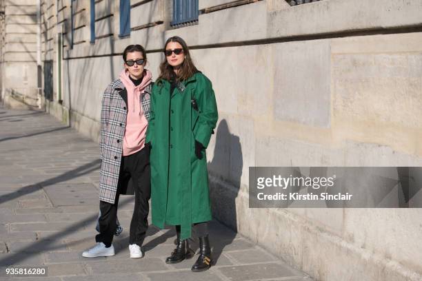 Fashion blogger for number-93 Sylvia Haghjoo wears Céline sunglasses, Burberry coat, Acne hooded sweater, Stella McCartney trousers and Adidas...