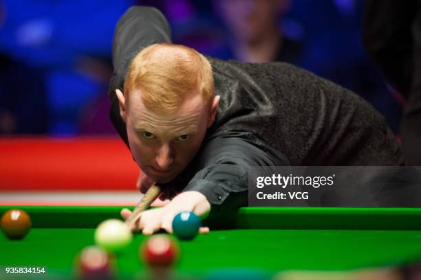 Anthony McGill of Scotland plays a shot during his first round match against John Higgins of Scotland on day three of 2018 Ladbrokes Players...