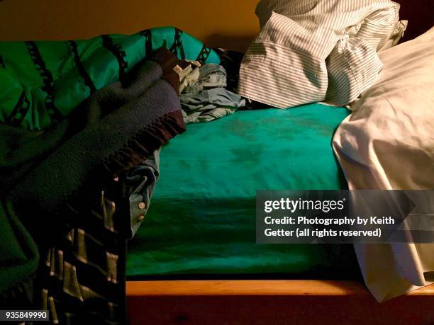 an unmade bed in a bedroom - pillow case stock pictures, royalty-free photos & images