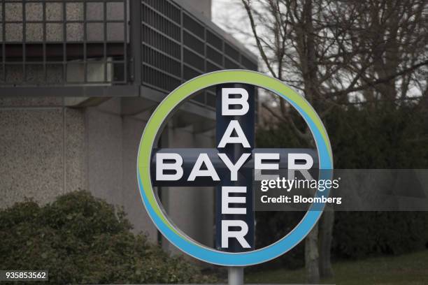 Logo sits on display outside the Bayer CropScience AG facility in Monheim, Germany, on Wednesday, March 21, 2018. Bayer cleared one big hurdle for...