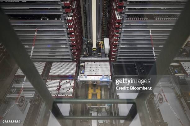 Trays containing vials of chemical research ingredients move through the substance library at the Bayer CropScience AG facility in Monheim, Germany,...