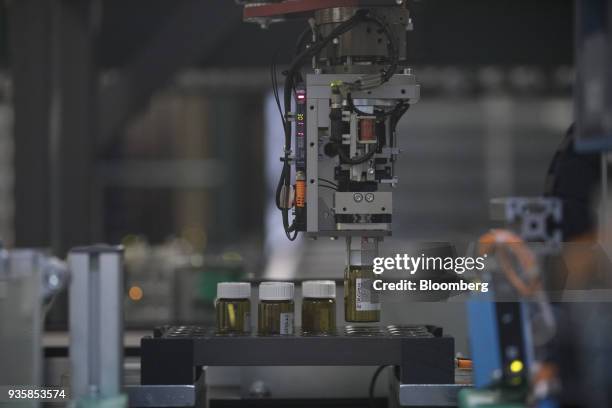 Robotic arm selects a vial containing chemical research ingredients inside the substance library at the Bayer CropScience AG facility in Monheim,...