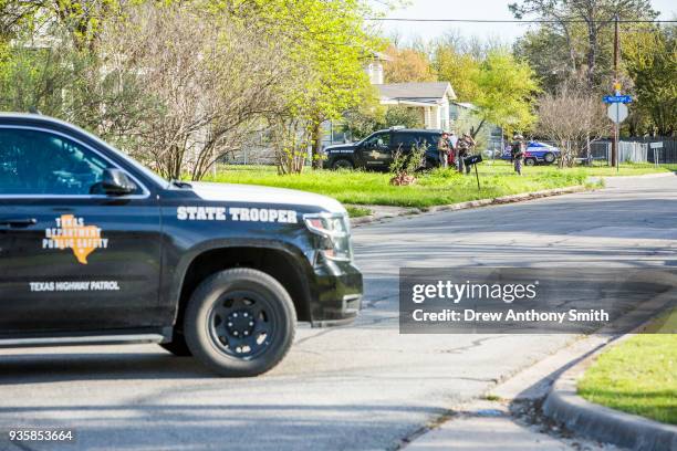 Police barricade the area surrounding the home of suspected Austin bomber Mark Anthony Conditt March 21, 2018 in Pflugerville, Texas. Conditt blew...