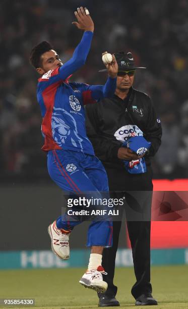 Cricketer Mohammad Amir of Karachi King delivers the ball during the Twenty20 cricket match of the Pakistan Super League between Peshawar Zalmi and...