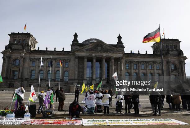 People bearing flags of the Kurdish YPG militia protest against the Turkish military intervention in Afrin province in Syria outside the Chancellery...