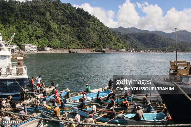 This general view from the port of Mutsamudu, the capital of the Comoros Union Island of Anjouan shows fisherman waiting for incoming boats on March...