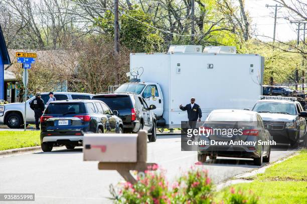 Police barricade the area surrounding the home of suspected Austin bomber Mark Anthony Conditt March 21, 2018 in Pflugerville, Texas. Conditt blew...