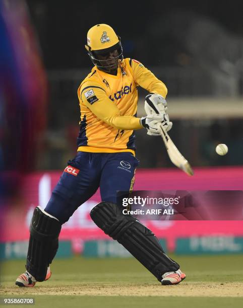 Peshawar Zalmi captain Darren Sammy plays a shot during the Twenty20 cricket match of the Pakistan Super League between Peshawar Zalmi and Karachi...