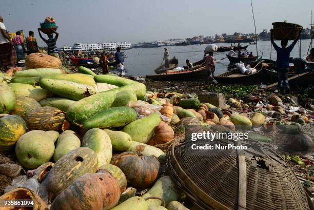 Bangladeshi workers making a small channel in the dry branch river of Buriganga river in Dhaka, Bangladesh, on March 21, 2018. World Water Day is...