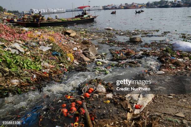 Bangladeshi workers making a small channel in the dry branch river of Buriganga river in Dhaka, Bangladesh, on March 21, 2018. World Water Day is...