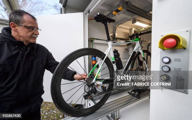 Bicycle is placed inside an new International Cycling Union mobile X-ray machine box during a press conference unveiling a beefed-up set of measures...