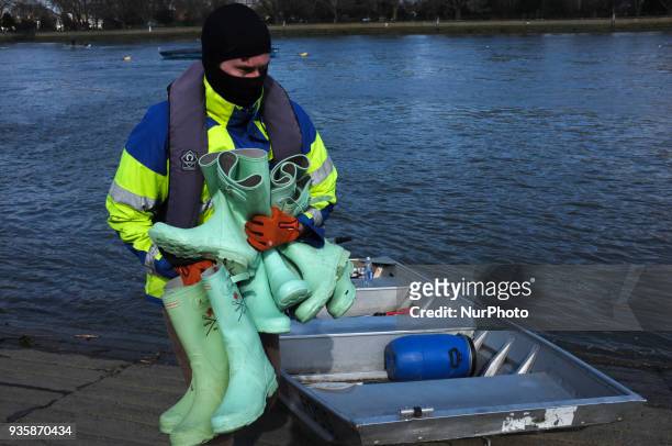 Oxford and Cambridge's women and men teams are seen during a training session in the area of Putney, London on March 21, 2018. The Boat Races will...