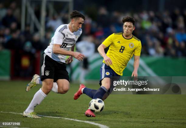 Adrian Fein of Germany and Jamie Barjonas of Scotland fight for the ball during the Under 19 Euro Qualifier between Germany and Scotland on March 21,...