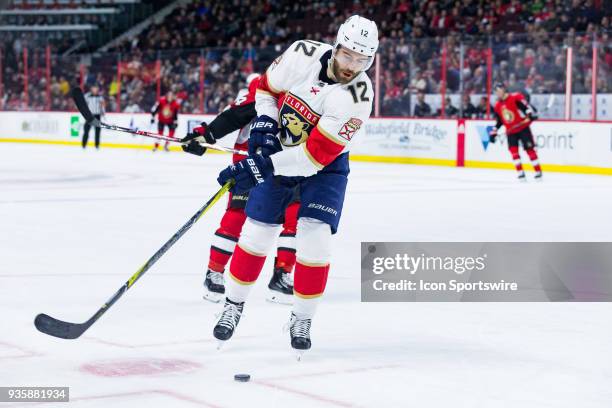 Florida Panthers Defenceman Ian McCoshen goes to backhand the puck during second period National Hockey League action between the Florida Panthers...