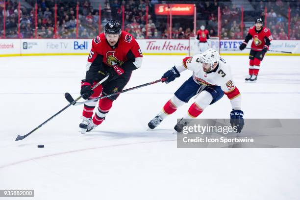 Ottawa Senators Defenceman Cody Ceci tries to get the puck around Florida Panthers Defenceman Keith Yandle during second period National Hockey...