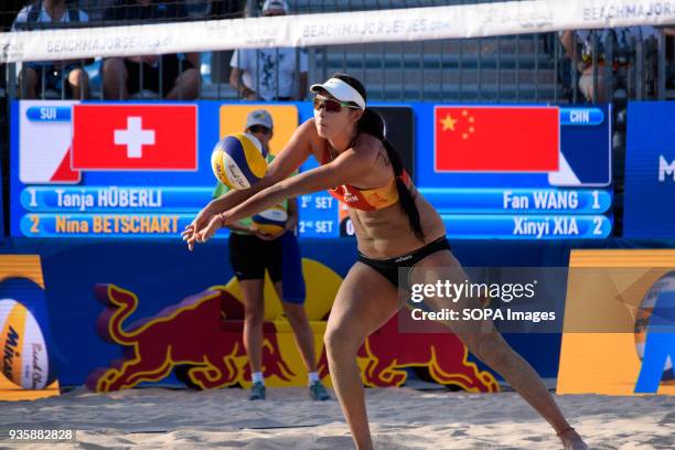 Fan Wang of the Chinese team seeks to place the ball to his partner for the point against Switzerland. The Volleyball Major Series 2018 Florida was...