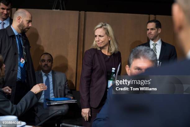 Homeland Security Secretary Kirstjen Nielsen, talks with Sen. Kamala Harris, D-Calif., left, after Nielsen testified at a Senate Intelligence...