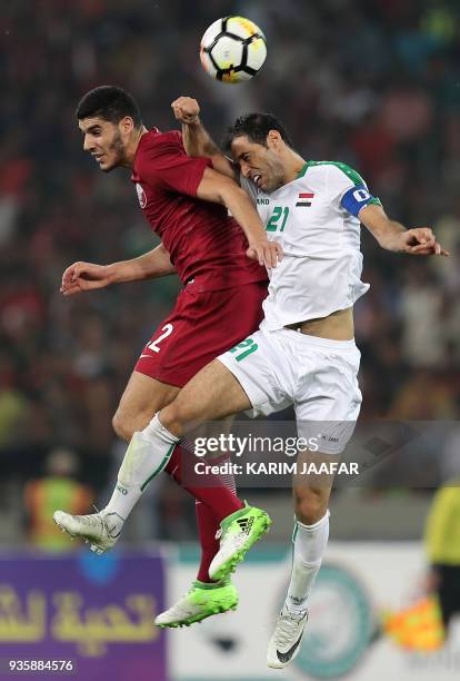 Iraq's midfielder Saad Abdul-Amir vies for the ball against Qatar's midfielder Karim Boudiaf during their international friendly match at Basra...