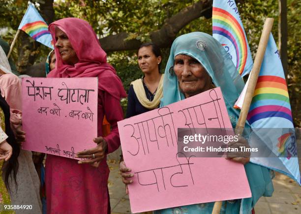 Senior citizens protesting against the delay in payment of pension from a long time and calling it as a scam during a protest march at Civil Lines on...