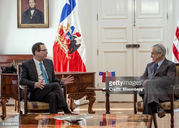 Steven Mnuchin, U.S. Treasury secretary, left, speaks while Sebastian Pinera, Chile's president, listens during a meeting at La Moneda Palace in...