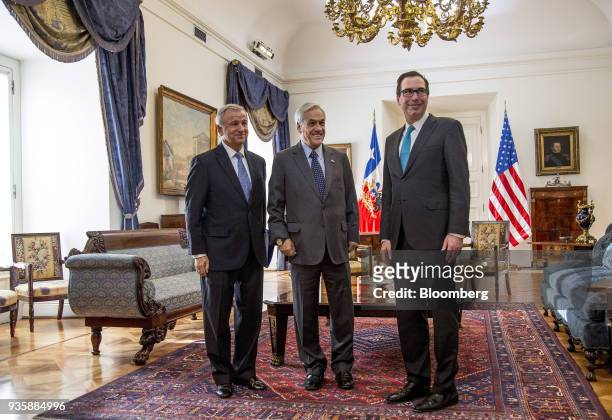 Felipe Larrain, Chile's finance minister, from left, Sebastian Pinera, Chile's president, and Steven Mnuchin, U.S. Treasury secretary, stand for a...