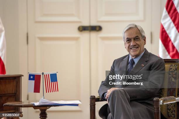 Sebastian Pinera, Chile's president, smiles during a meeting with Steven Mnuchin, U.S. Treasury secretary, not pictured, at La Moneda Palace in...